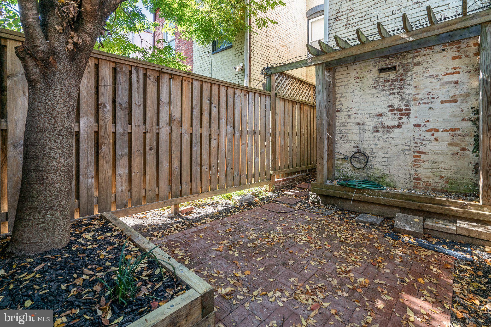 1257 35th Street Northwest Washington, DC 20007 - Photo 21 of 21 a view of a pathway of a yard with wooden fence
