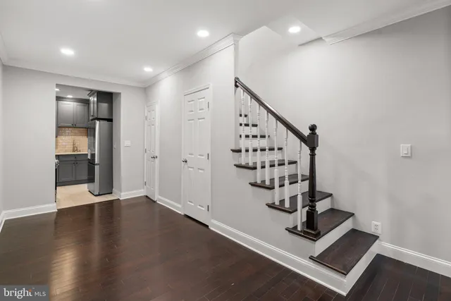 a view of an entryway with wooden floor