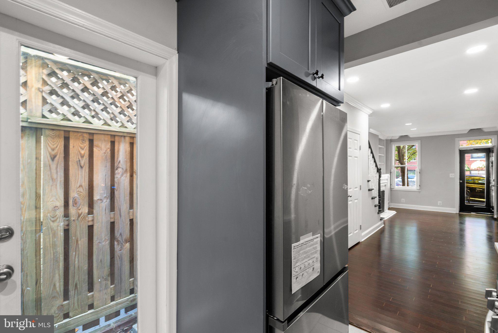 1257 35th Street Northwest Washington, DC 20007 - Photo 8 of 21 a view of a hallway with wooden floor and staircase