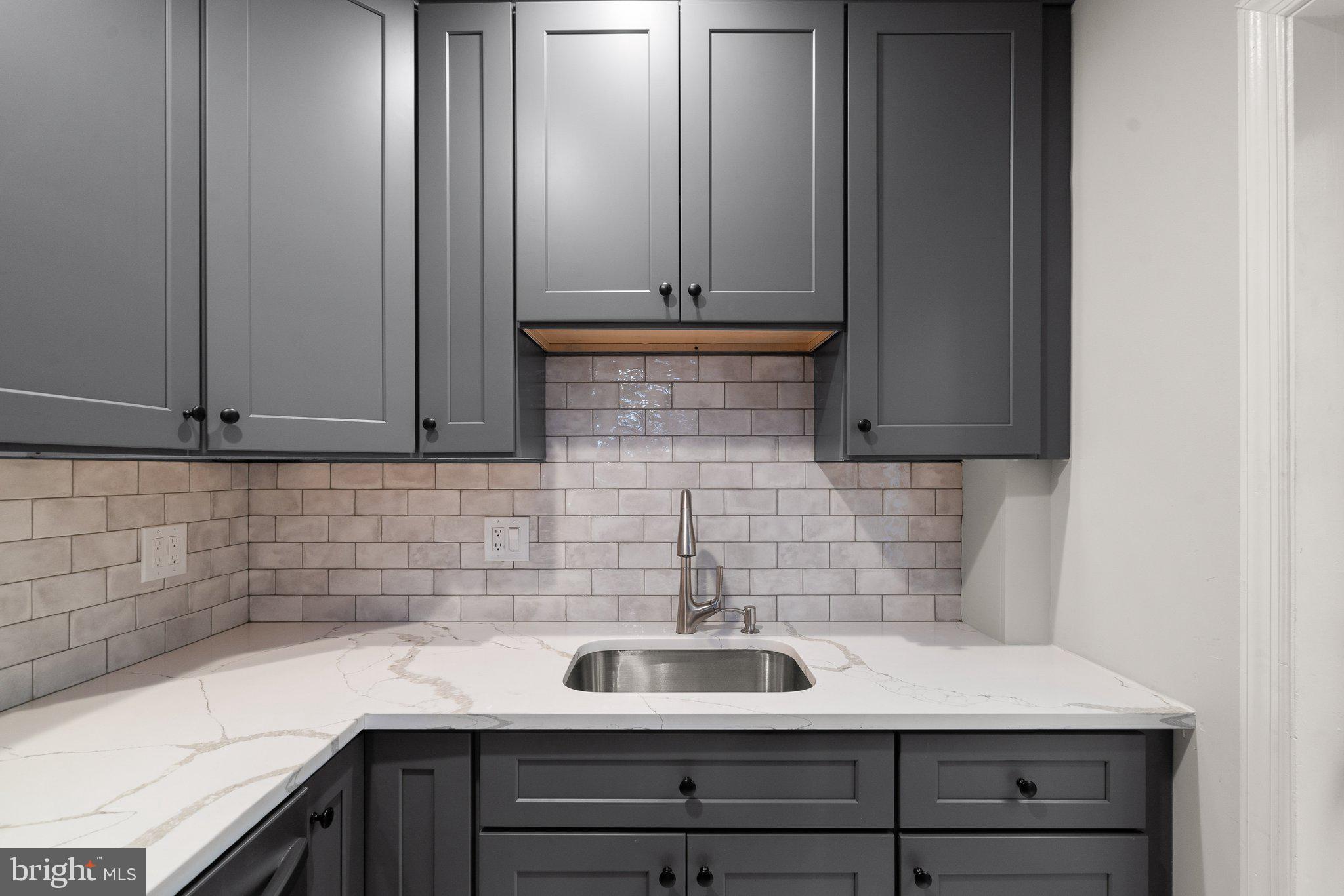 1257 35th Street Northwest Washington, DC 20007 - Photo 9 of 21 a kitchen with a sink and cabinets