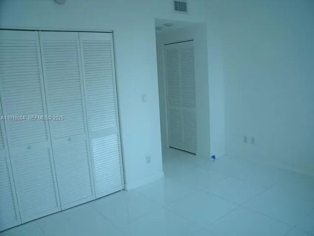 a kitchen with counter top space cabinets and appliances