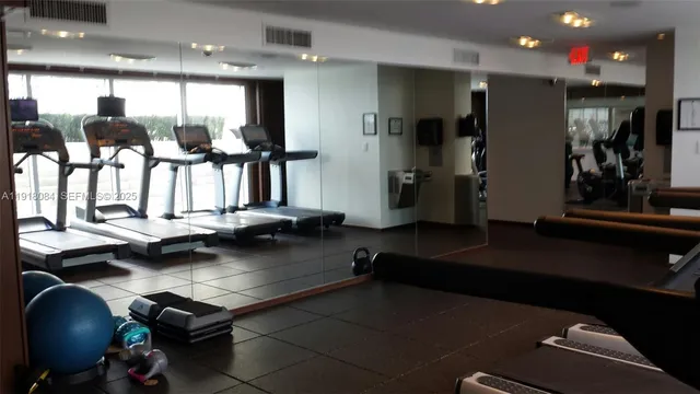 a view of cabinets a sink and dishwasher in a bathroom