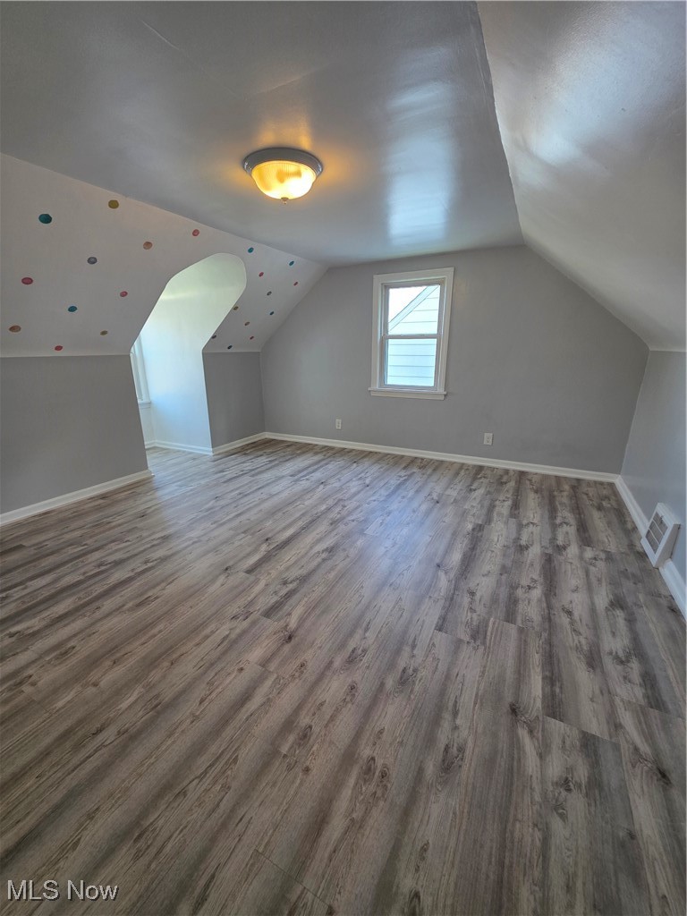 12813 North Road Cleveland, OH 44111 - Photo 18 of 30 Bonus room featuring light wood finished floors and vaulted ceiling