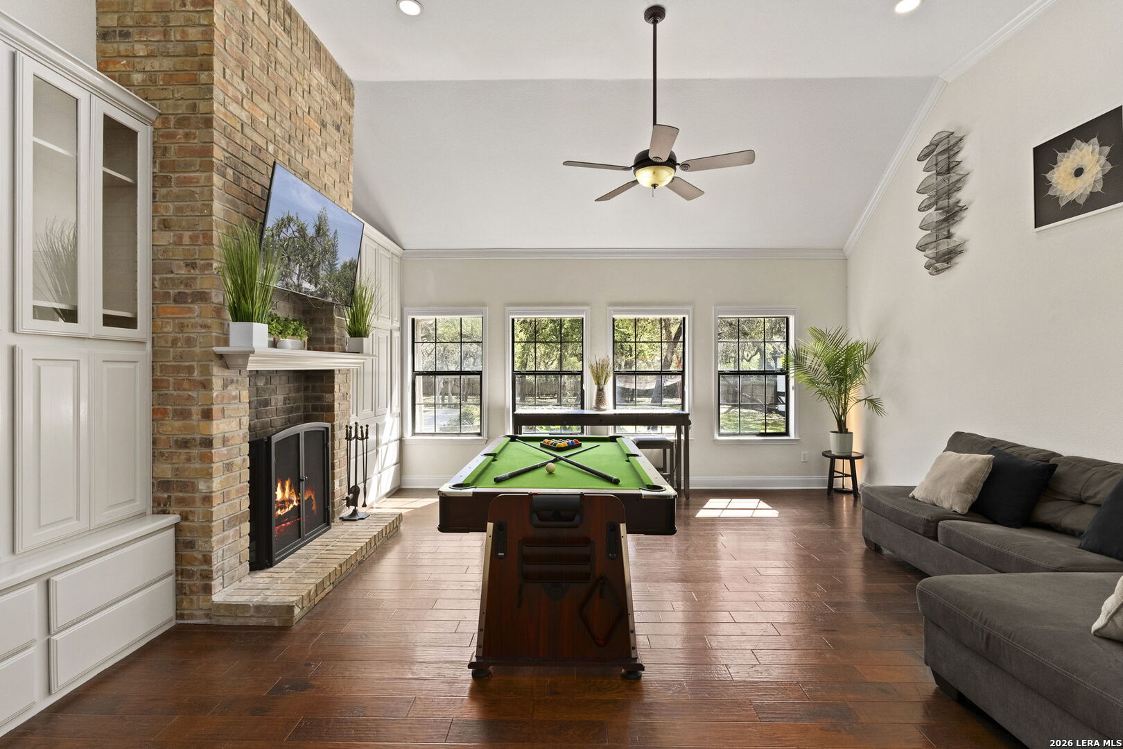 10918 Hunters Way Helotes, TX 78023 - Photo 12 of 49 a living room with furniture fireplace and window