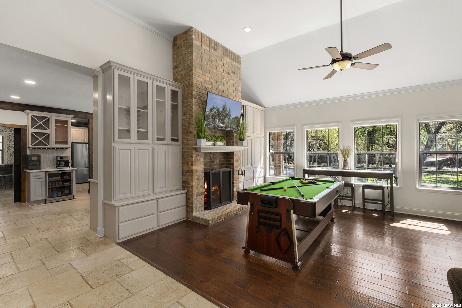 10918 Hunters Way Helotes, TX 78023 - Photo 13 of 49 a living room with furniture a fireplace and a large window