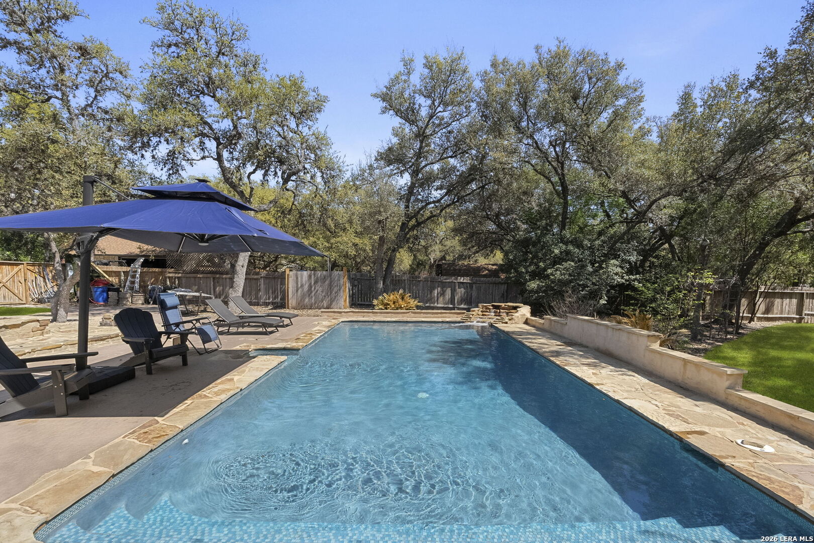 10918 Hunters Way Helotes, TX 78023 - Photo 34 of 49 a view of swimming pool with sitting area and furniture