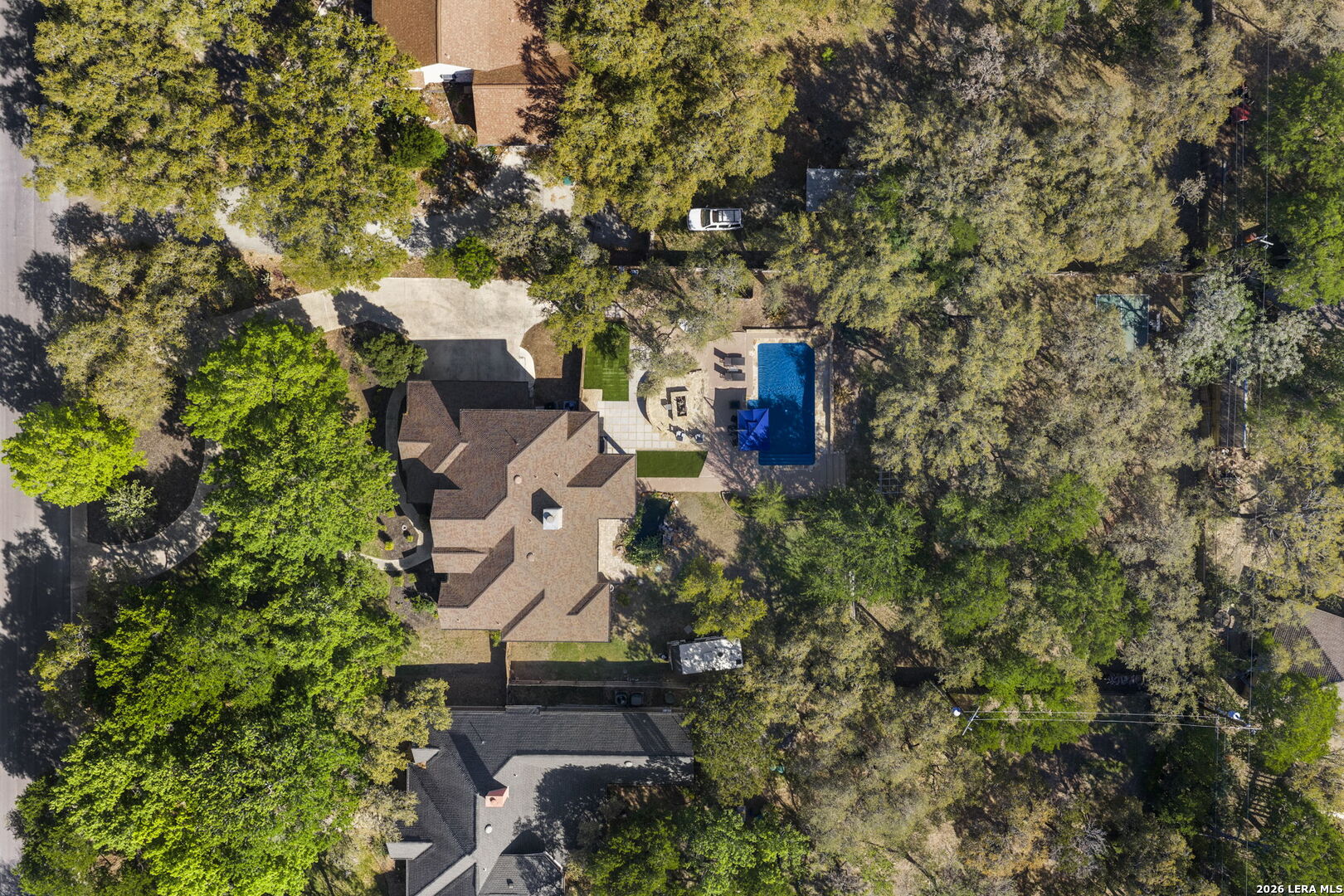 10918 Hunters Way Helotes, TX 78023 - Photo 4 of 49 an aerial view of a house with a yard