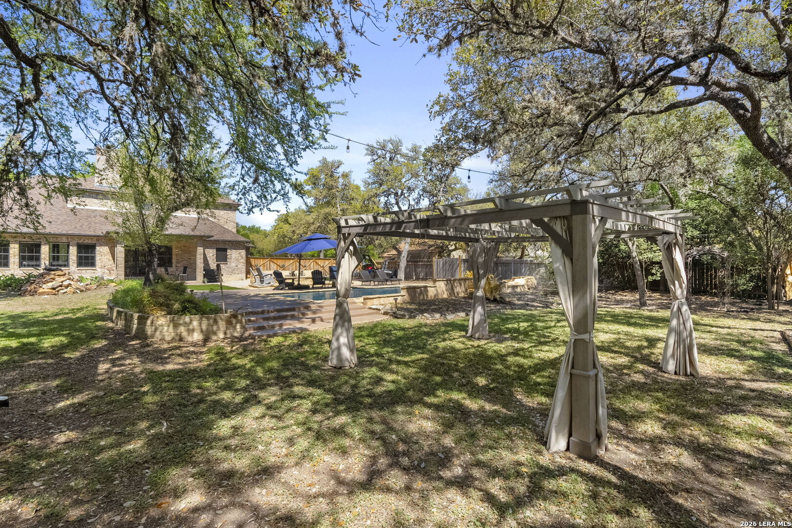 10918 Hunters Way Helotes, TX 78023 - Photo 43 of 49 a house view with a tree in front of it