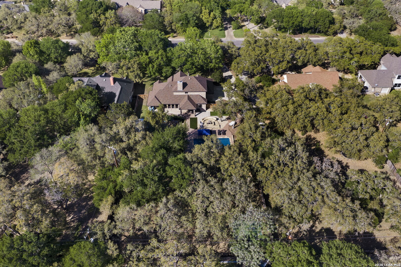 10918 Hunters Way Helotes, TX 78023 - Photo 47 of 49 an aerial view of residential house with parking and yard