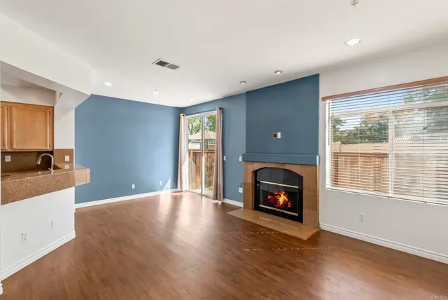 a view of a room window and wooden floor