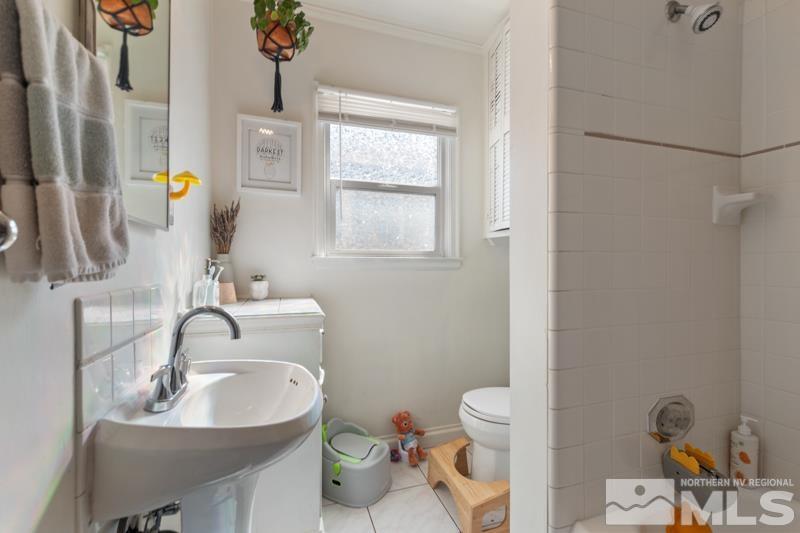 1451 Forest Street Reno, NV 89509 - Photo 12 of 23 a bathroom with a sink toilet and mirror