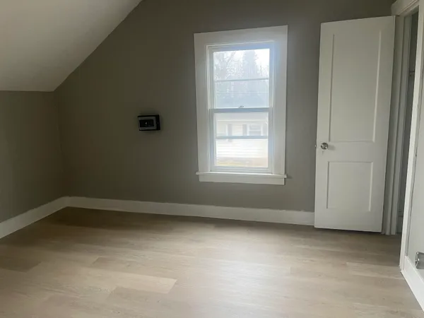 a front view of a house with parking area