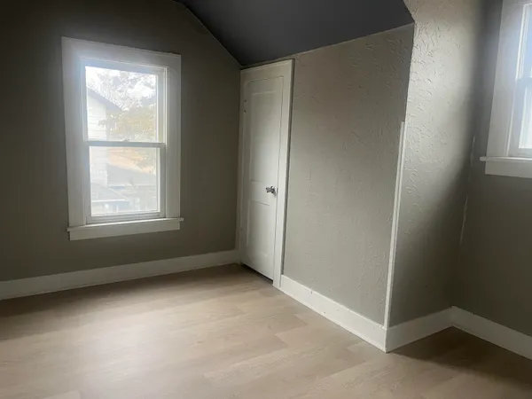 a house with trees in the background