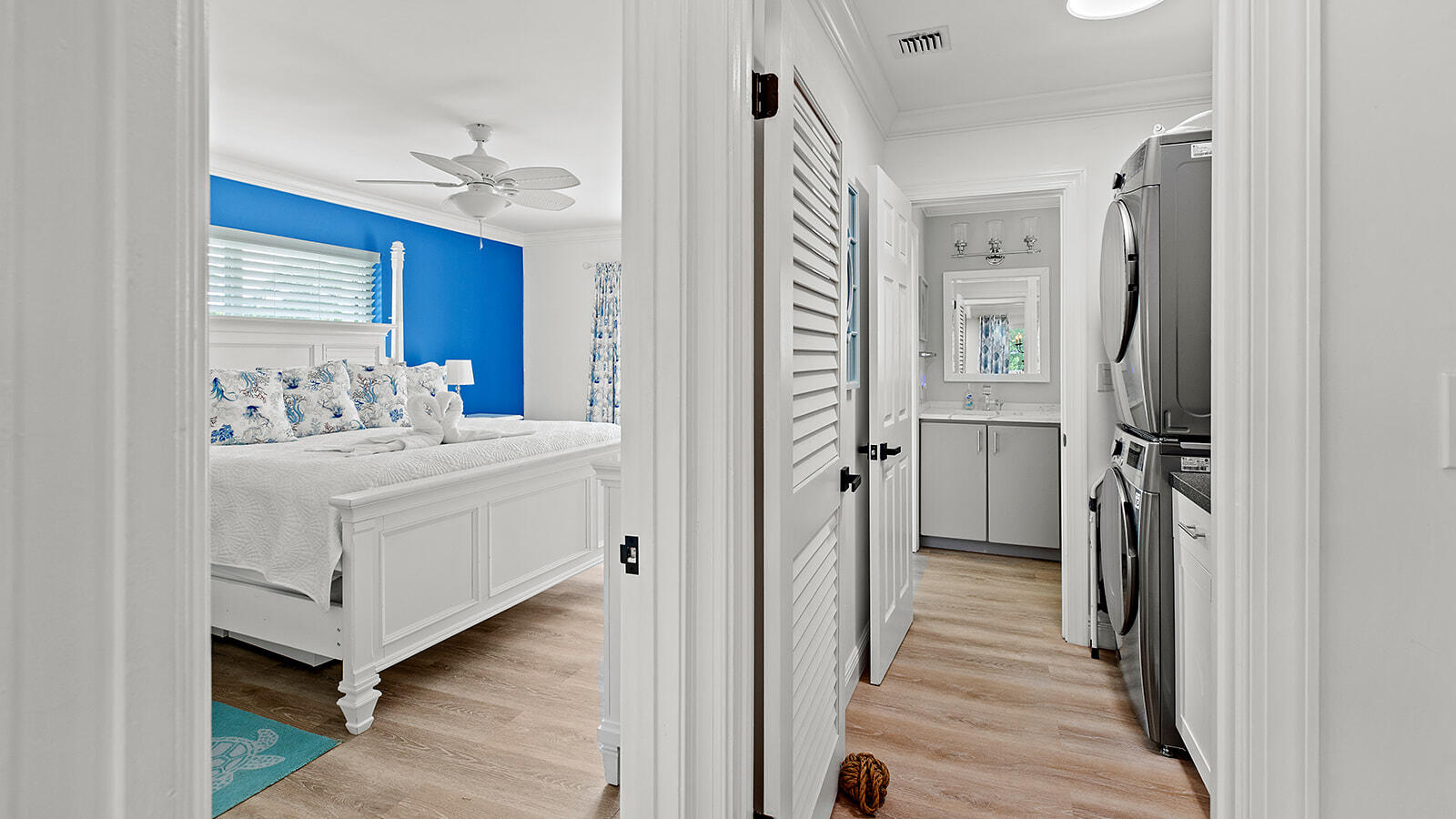 220 15th Circle Key Colony Beach, FL 33051 - Photo 12 of 43 a white bed sitting in a room next to a bathroom