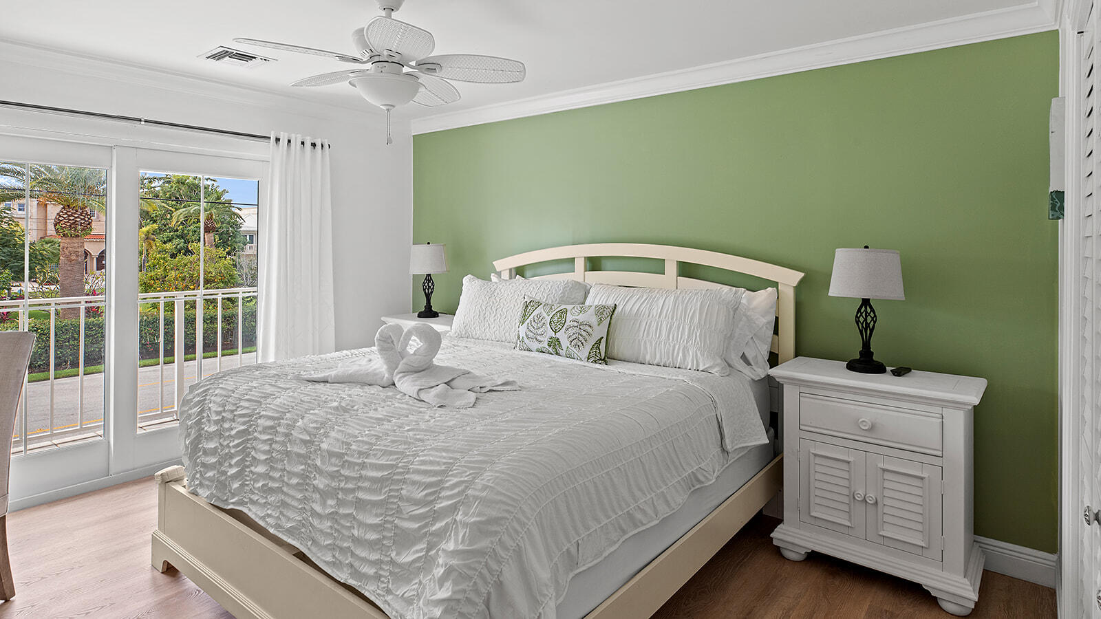 220 15th Circle Key Colony Beach, FL 33051 - Photo 17 of 43 a bed sitting in a bedroom next to a window