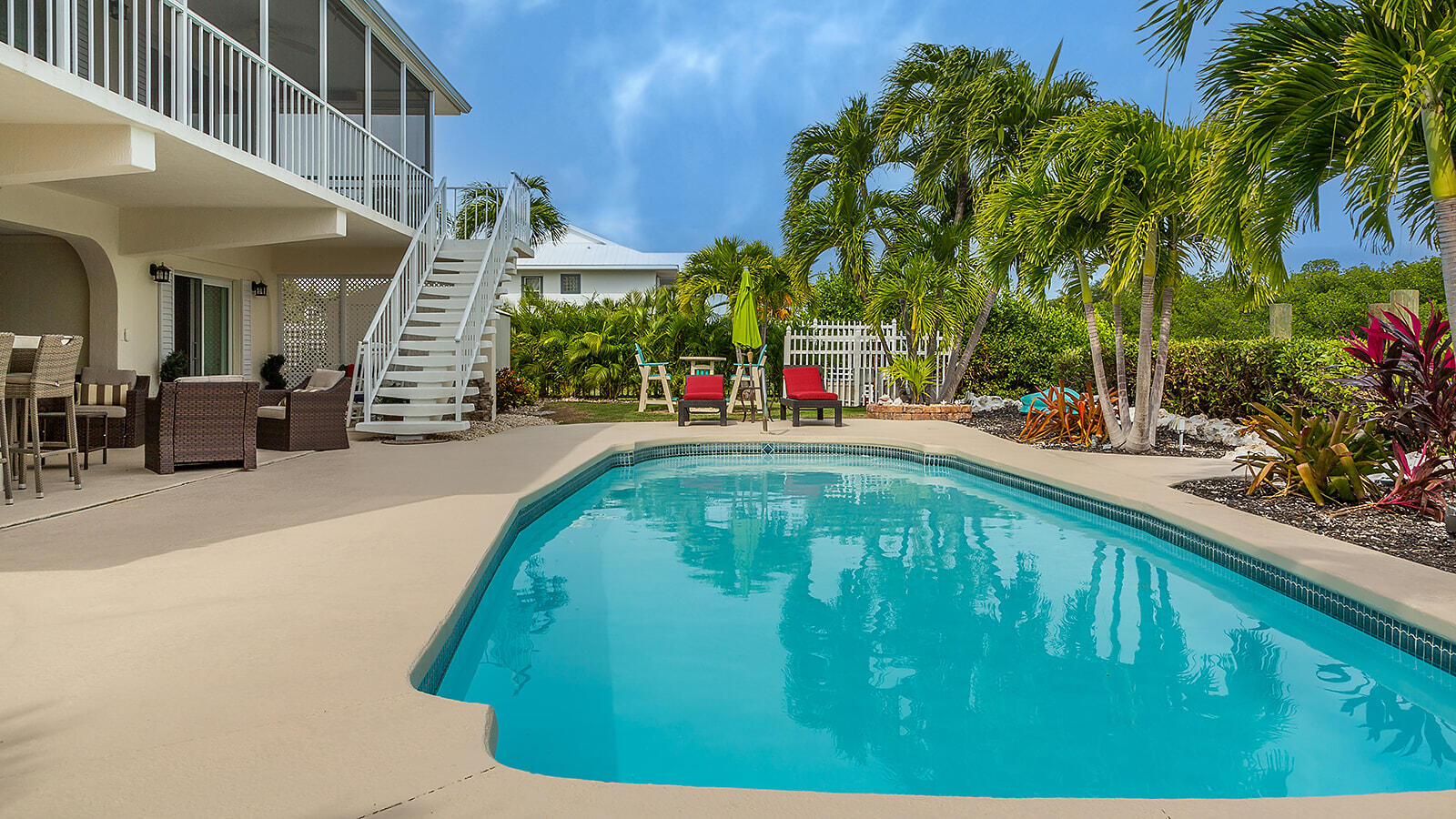220 15th Circle Key Colony Beach, FL 33051 - Photo 20 of 43 a swimming pool with outdoor seating and yard