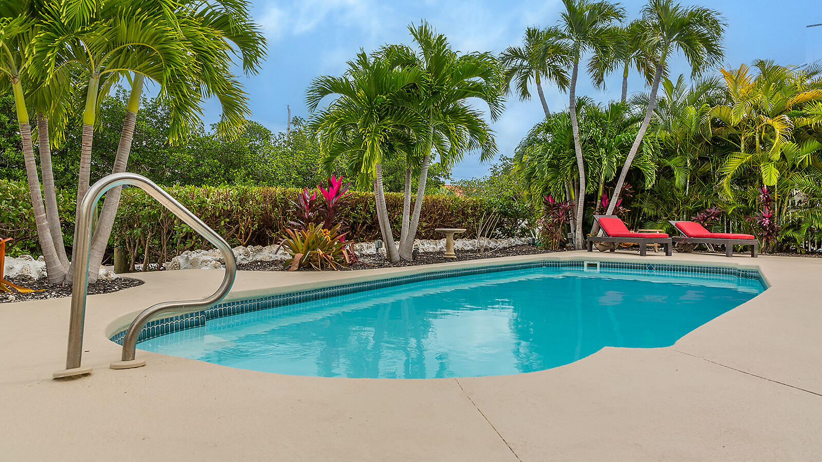 220 15th Circle Key Colony Beach, FL 33051 - Photo 23 of 43 a view of swimming pool with a table and chairs
