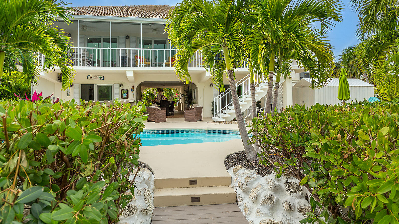 220 15th Circle Key Colony Beach, FL 33051 - Photo 24 of 43 a front view of a house with a yard