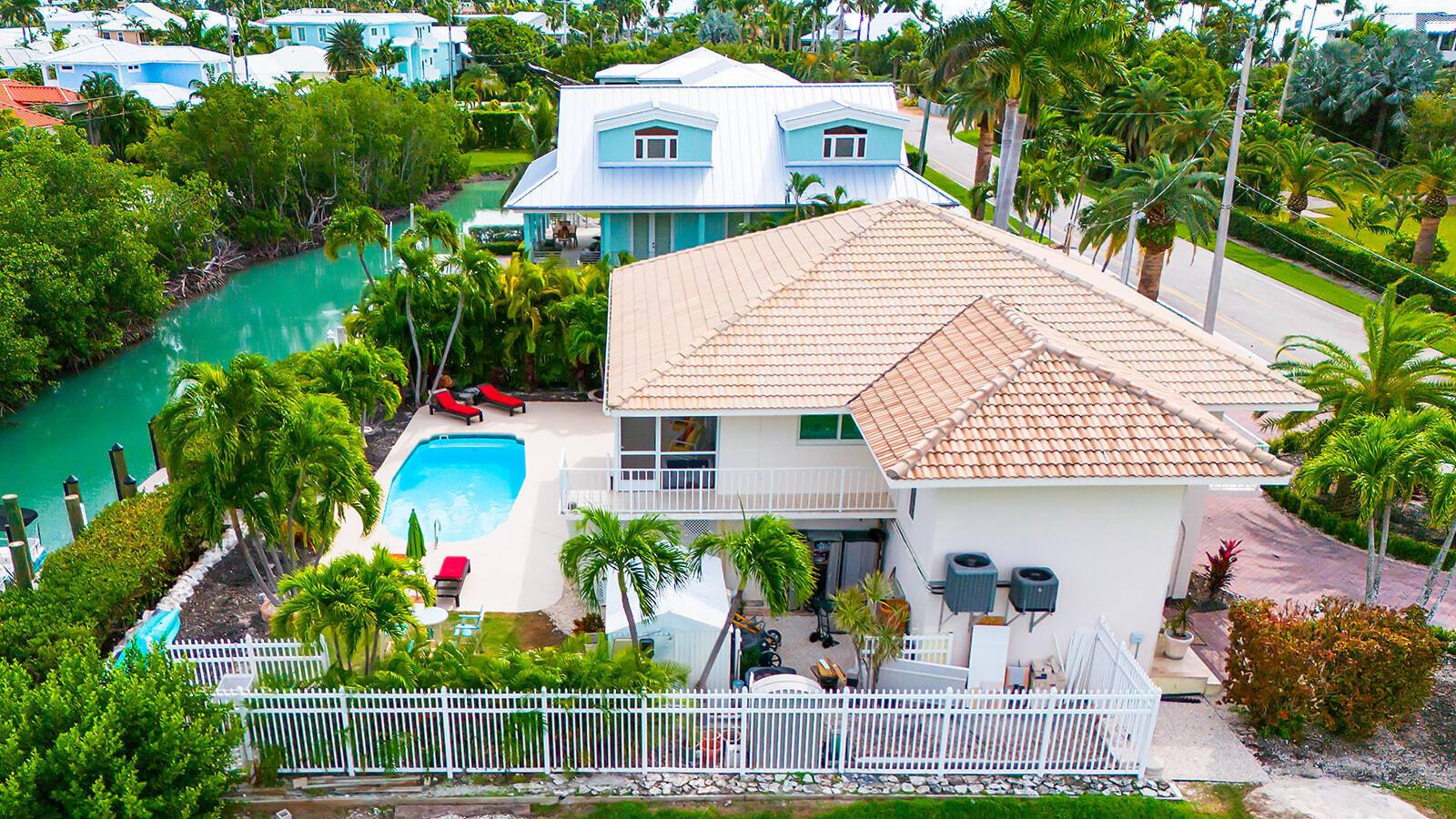 220 15th Circle Key Colony Beach, FL 33051 - Photo 3 of 43 a front view of house with an outdoor space