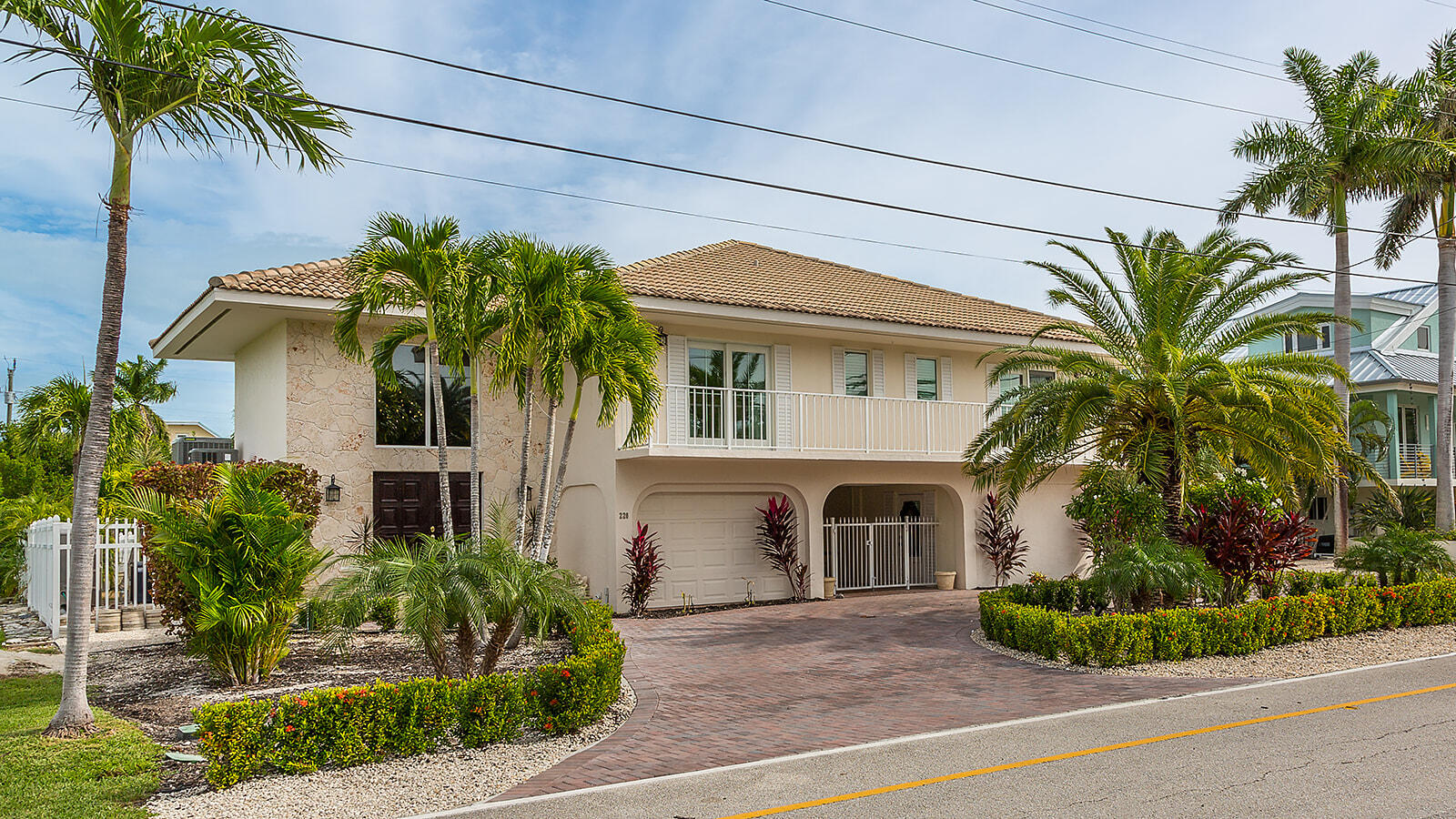 220 15th Circle Key Colony Beach, FL 33051 - Photo 40 of 43 a front view of a house with a garden