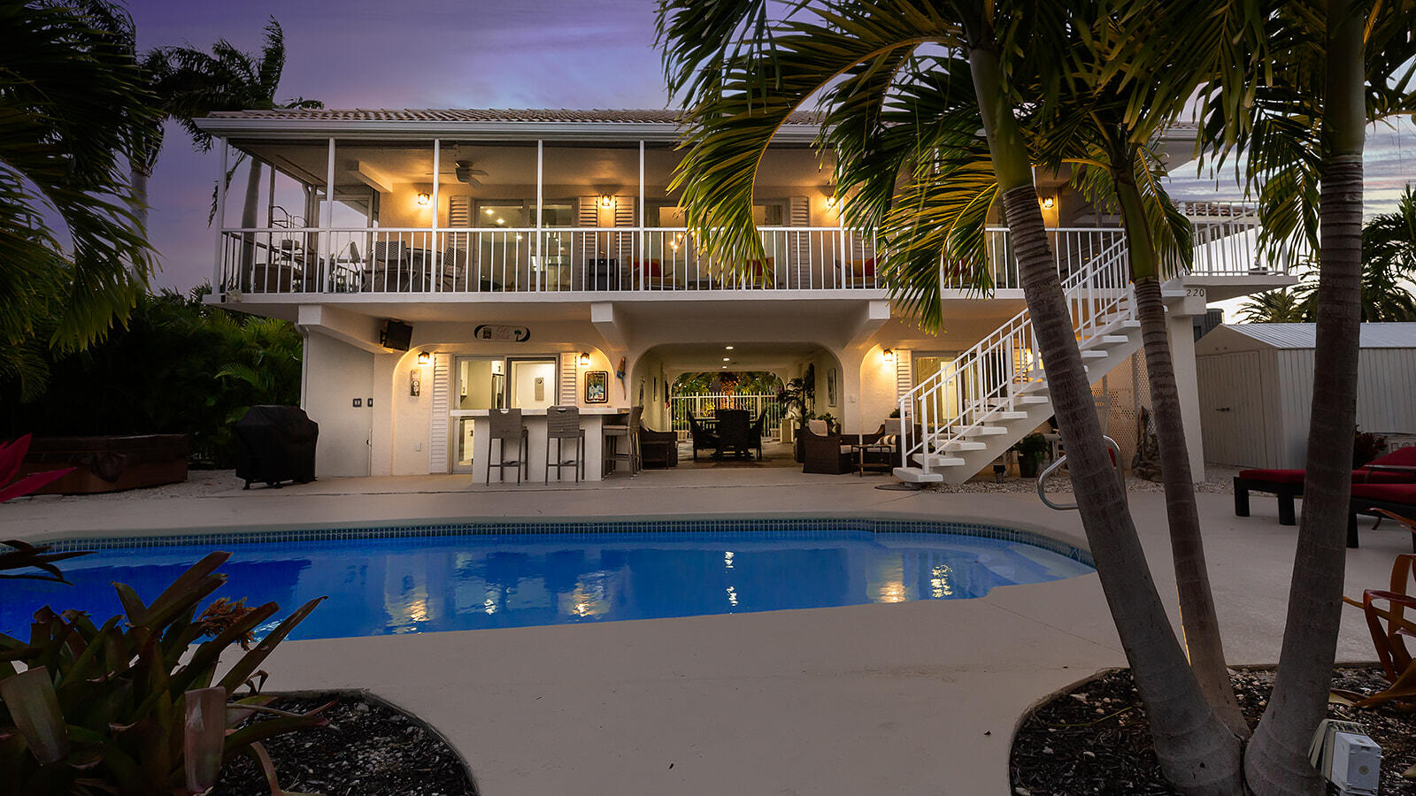 220 15th Circle Key Colony Beach, FL 33051 - Photo 42 of 43 a front view of a house with lots of trees