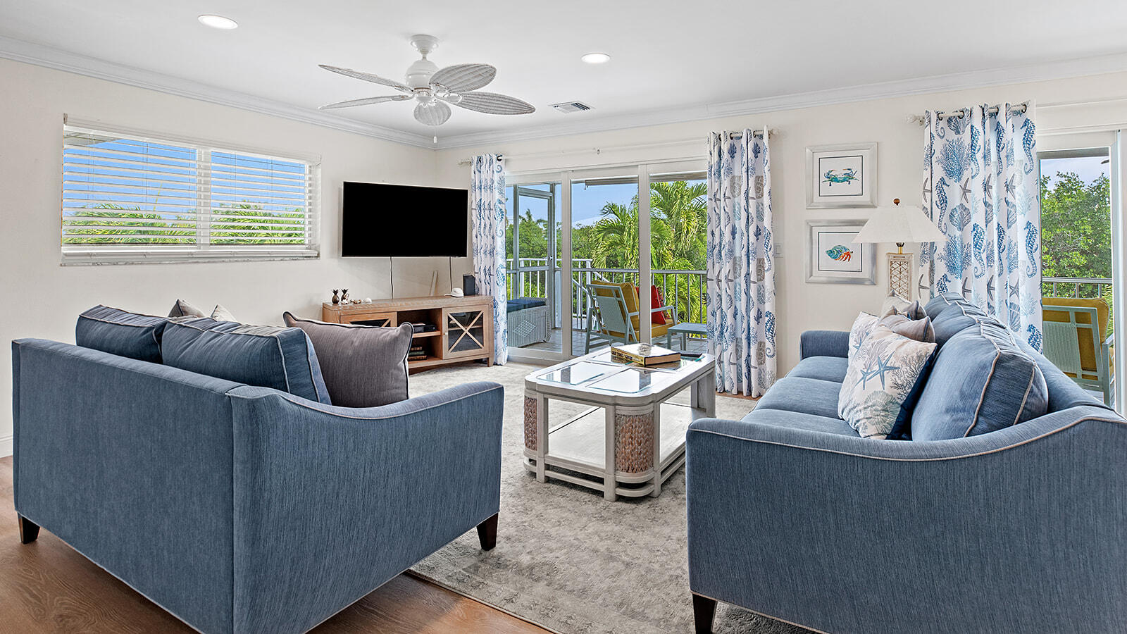 220 15th Circle Key Colony Beach, FL 33051 - Photo 7 of 43 a living room with furniture a flat screen tv and a large window