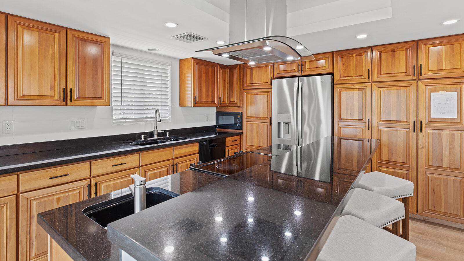 220 15th Circle Key Colony Beach, FL 33051 - Photo 10 of 43 a kitchen with stainless steel appliances granite countertop a sink a stove and a refrigerator