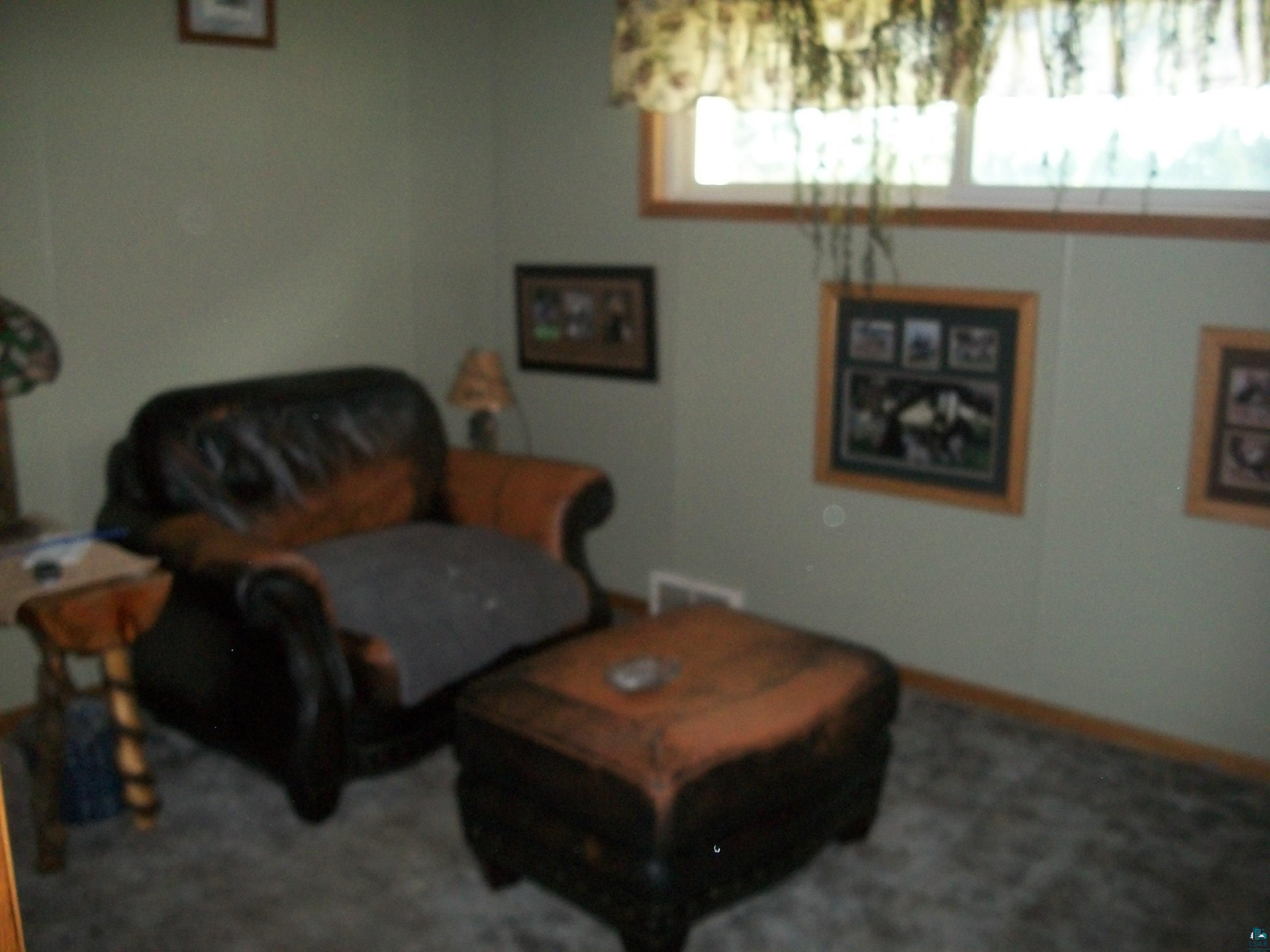 3917 Highway 5 Hibbing, MN 55746 - Photo 13 of 36 Living area featuring baseboards