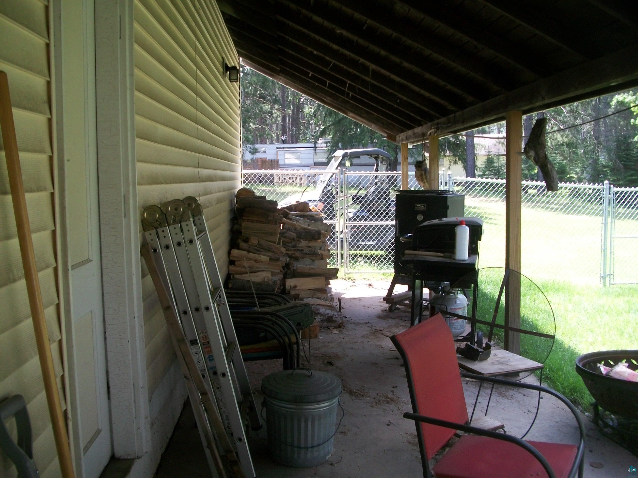 3917 Highway 5 Hibbing, MN 55746 - Photo 29 of 36 View of patio / terrace featuring fence