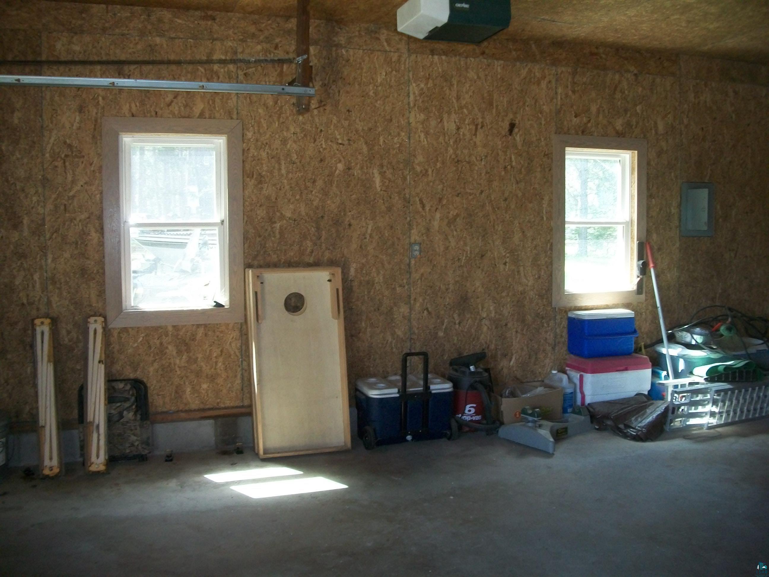 3917 Highway 5 Hibbing, MN 55746 - Photo 31 of 36 Garage with electric panel and a garage door opener