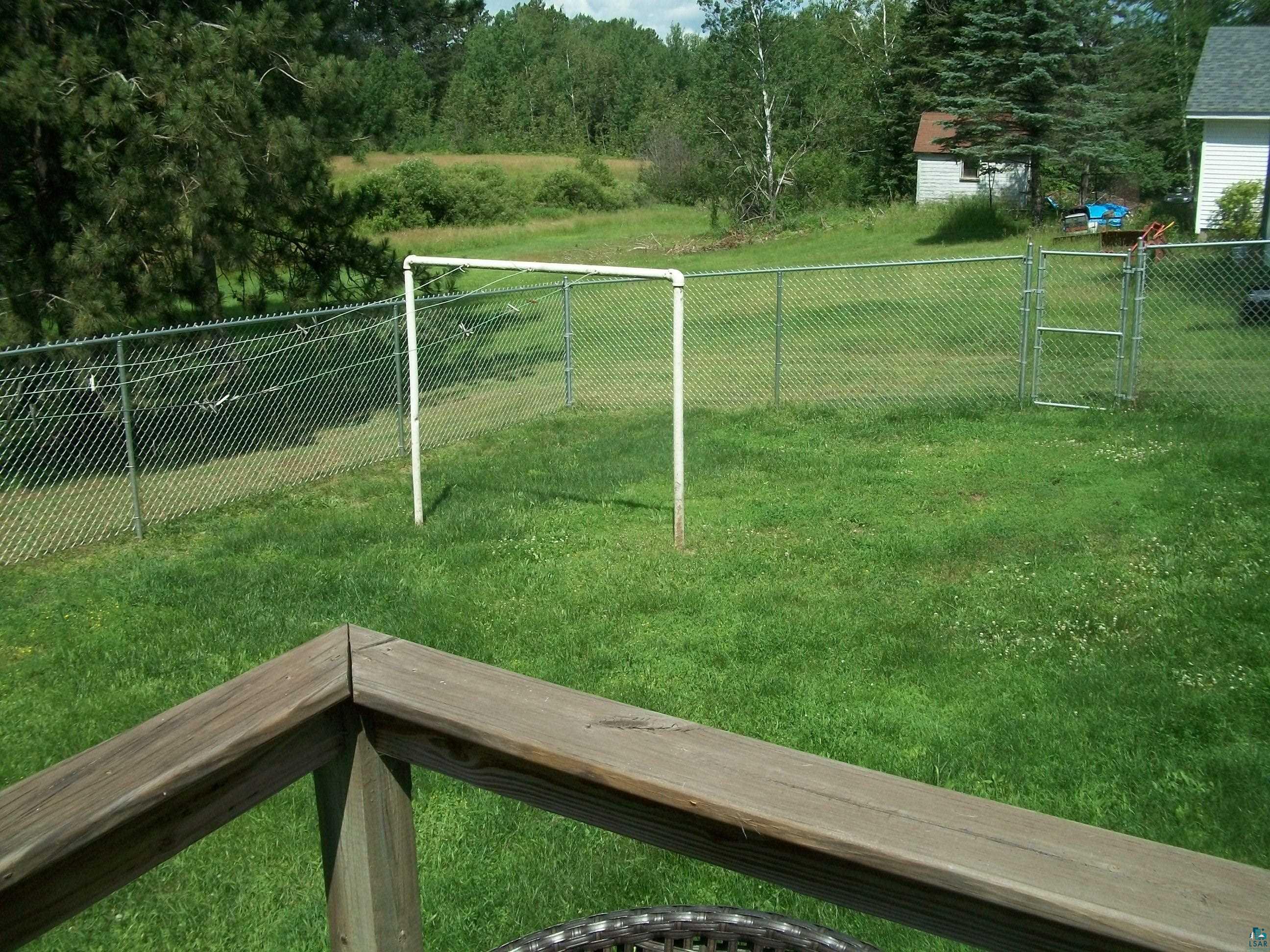 3917 Highway 5 Hibbing, MN 55746 - Photo 34 of 36 Surrounding community with a lawn and fence