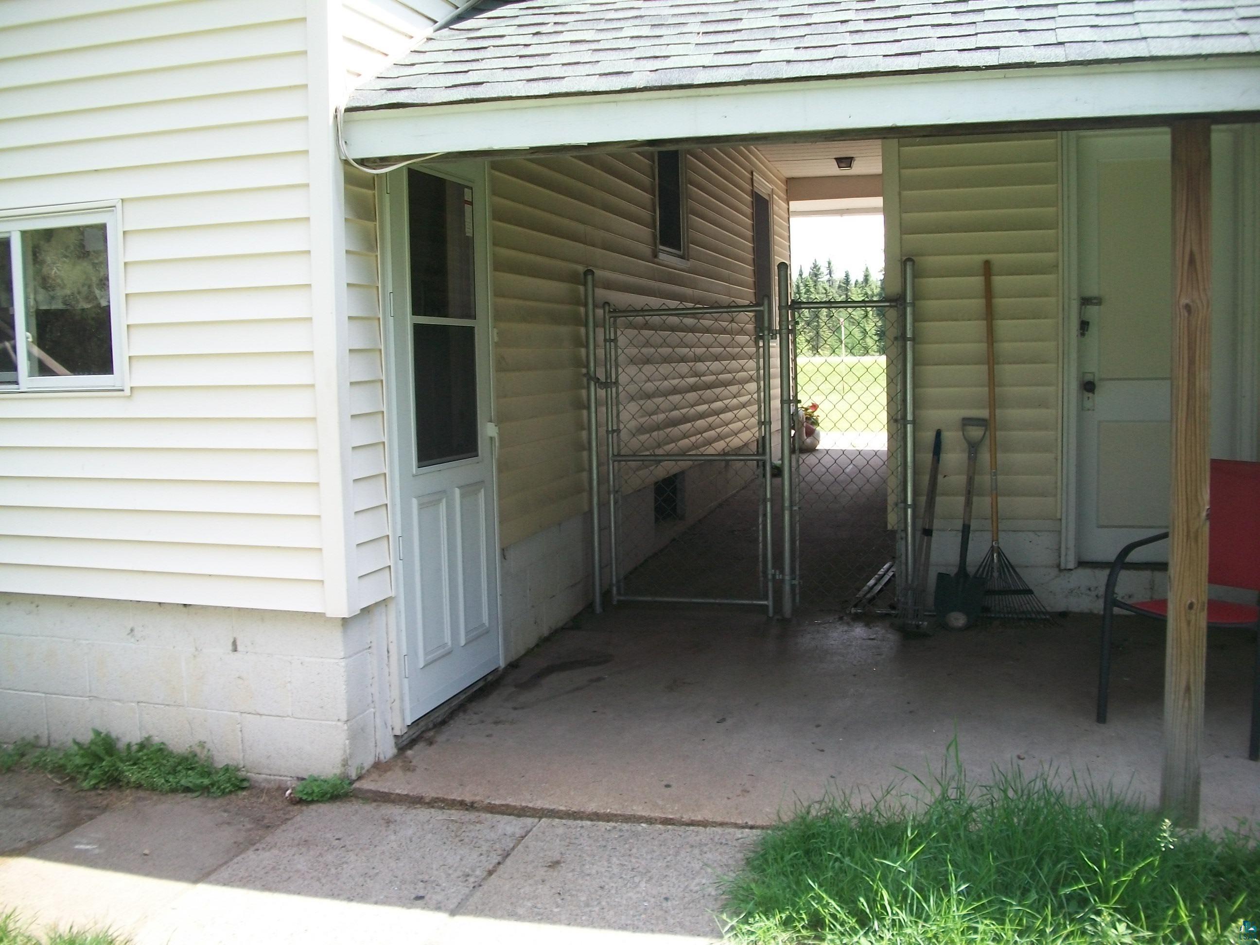 3917 Highway 5 Hibbing, MN 55746 - Photo 4 of 36 Property entrance with a gate, a carport, and roof with shingles