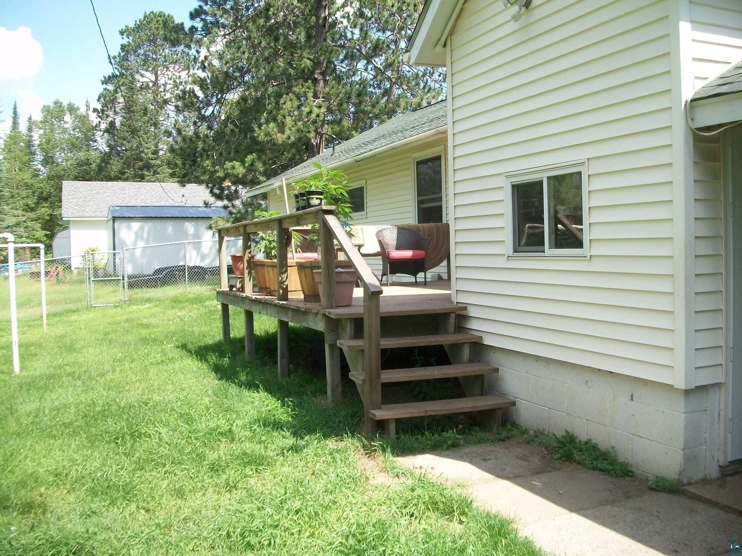 3917 Highway 5 Hibbing, MN 55746 - Photo 5 of 36 View of yard featuring fence and a deck