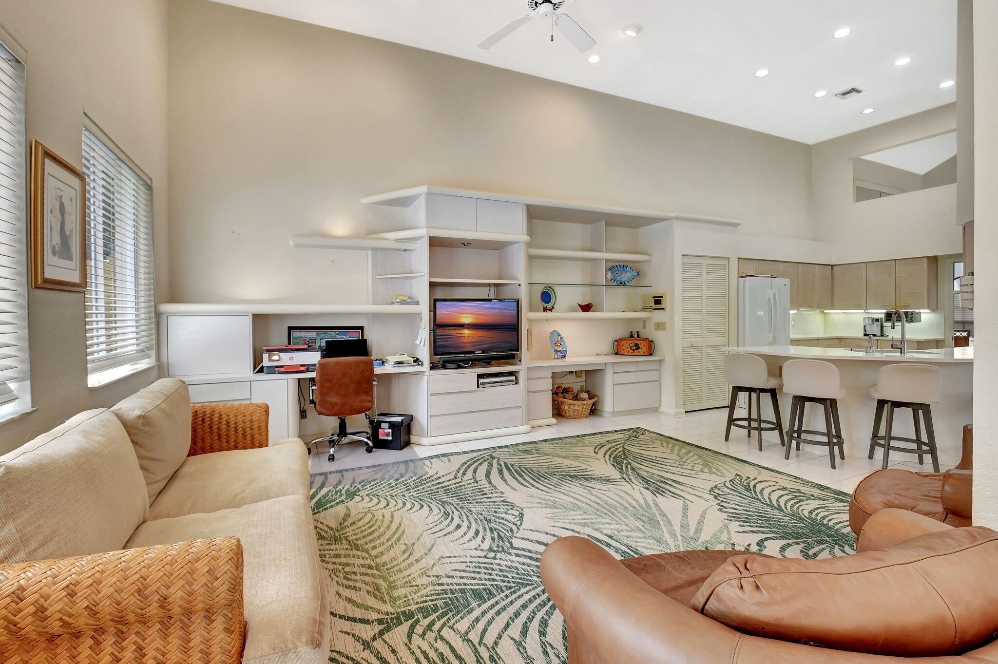 2462 Northwest 66th Drive Boca Raton, FL 33496 - Photo 12 of 49 a living room with furniture and a flat screen tv