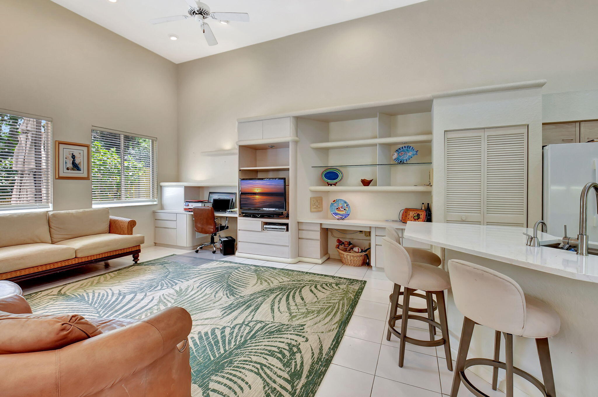 2462 Northwest 66th Drive Boca Raton, FL 33496 - Photo 13 of 49 a living room with furniture cabinets and a flat screen tv