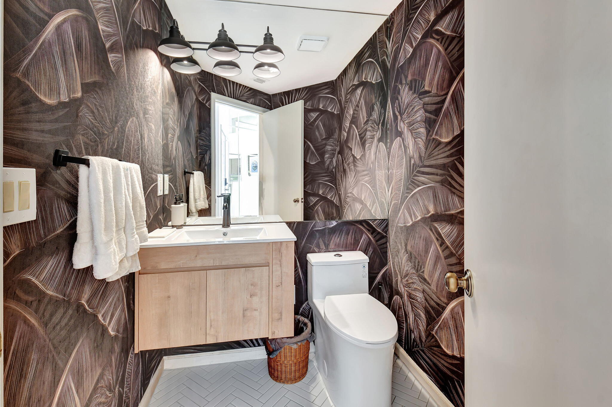 2462 Northwest 66th Drive Boca Raton, FL 33496 - Photo 21 of 49 a bathroom with a toilet sink and mirror