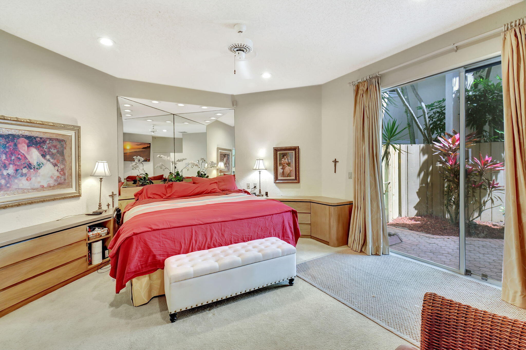 2462 Northwest 66th Drive Boca Raton, FL 33496 - Photo 22 of 49 a spacious bedroom with a bed and glass door