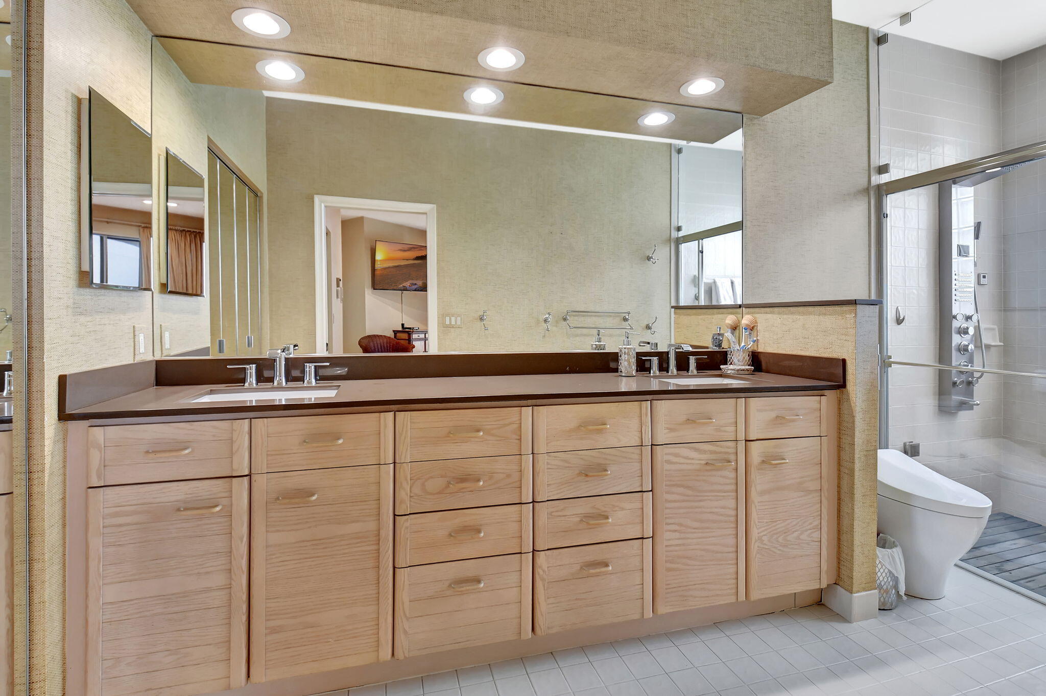 2462 Northwest 66th Drive Boca Raton, FL 33496 - Photo 24 of 49 a bathroom with a double vanity sink a toilet and a mirror