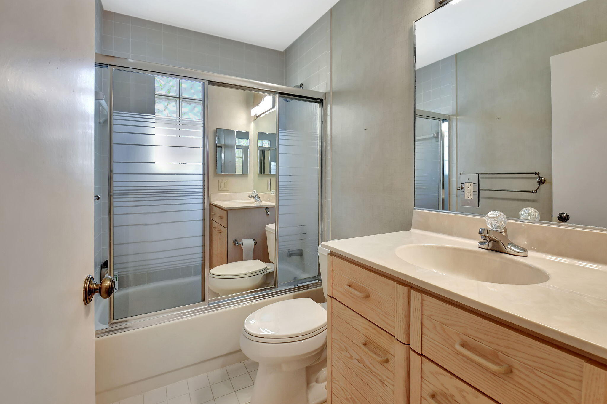 2462 Northwest 66th Drive Boca Raton, FL 33496 - Photo 29 of 49 a bathroom with a sink a toilet and shower
