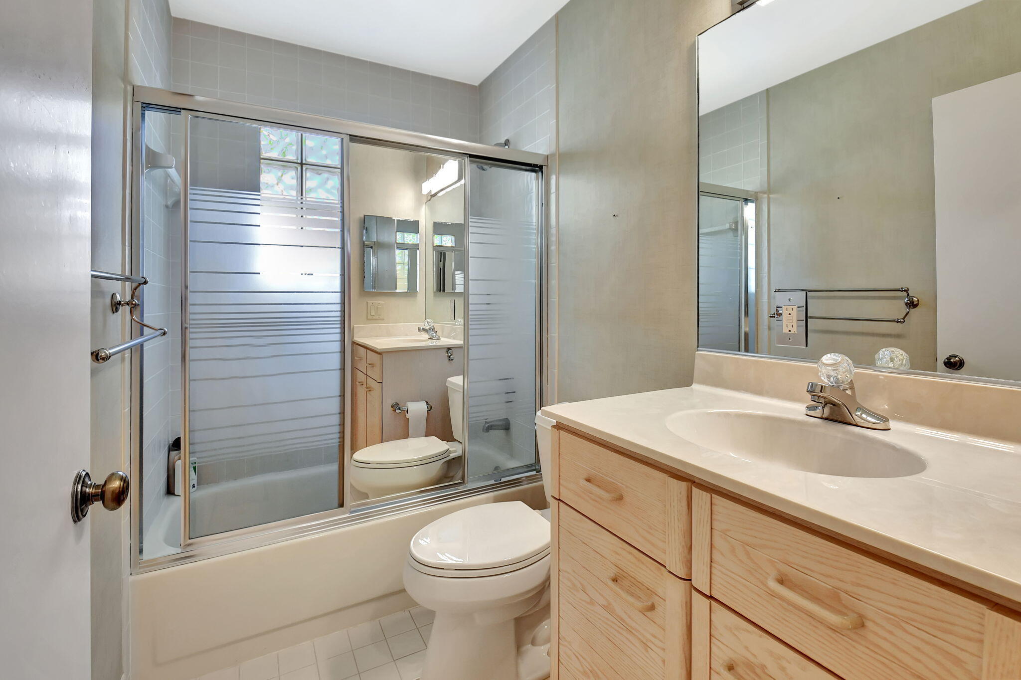 2462 Northwest 66th Drive Boca Raton, FL 33496 - Photo 30 of 49 a bathroom with a sink toilet vanity and shower