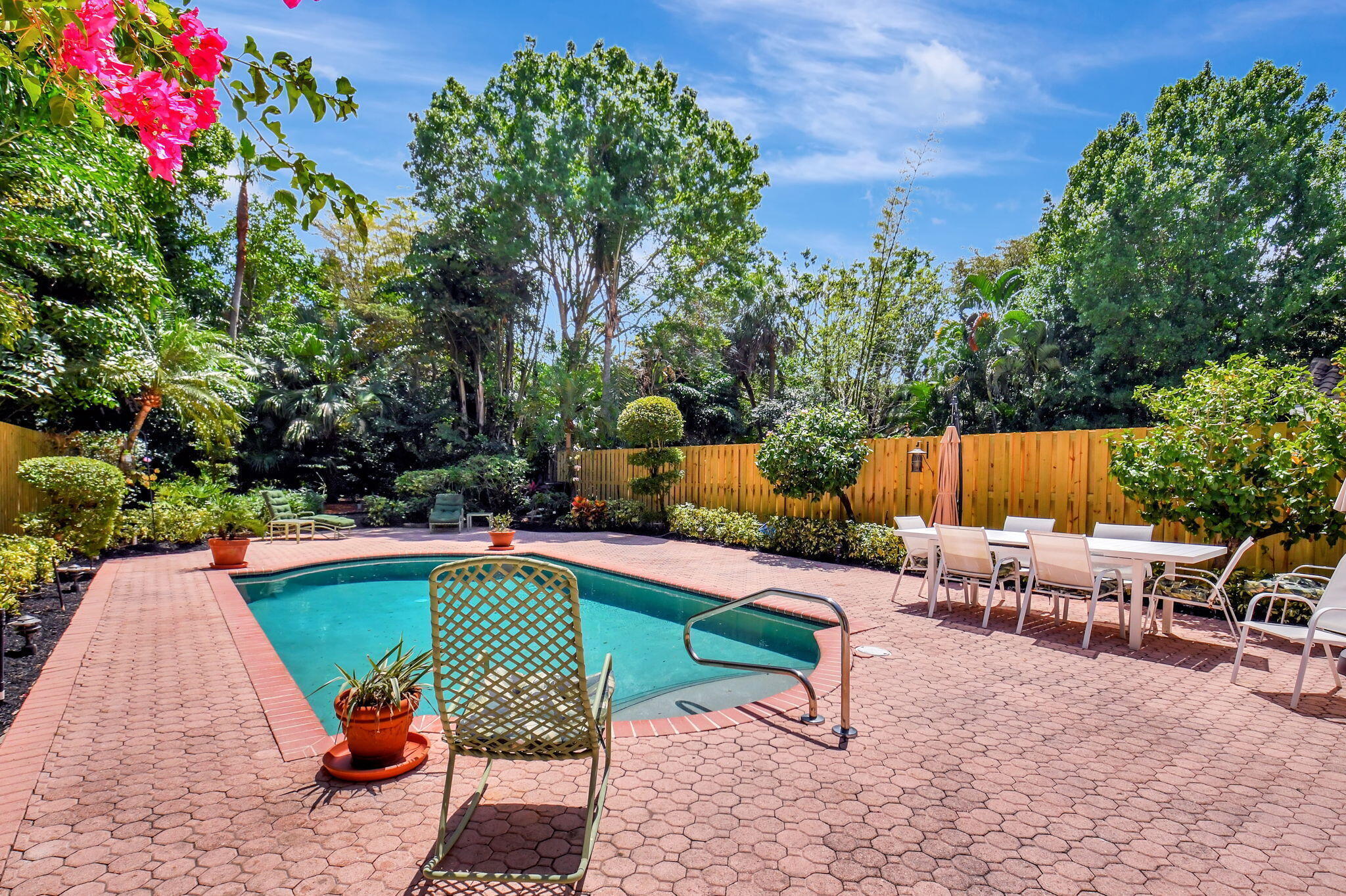 2462 Northwest 66th Drive Boca Raton, FL 33496 - Photo 33 of 49 a swimming pool with outdoor seating and yard