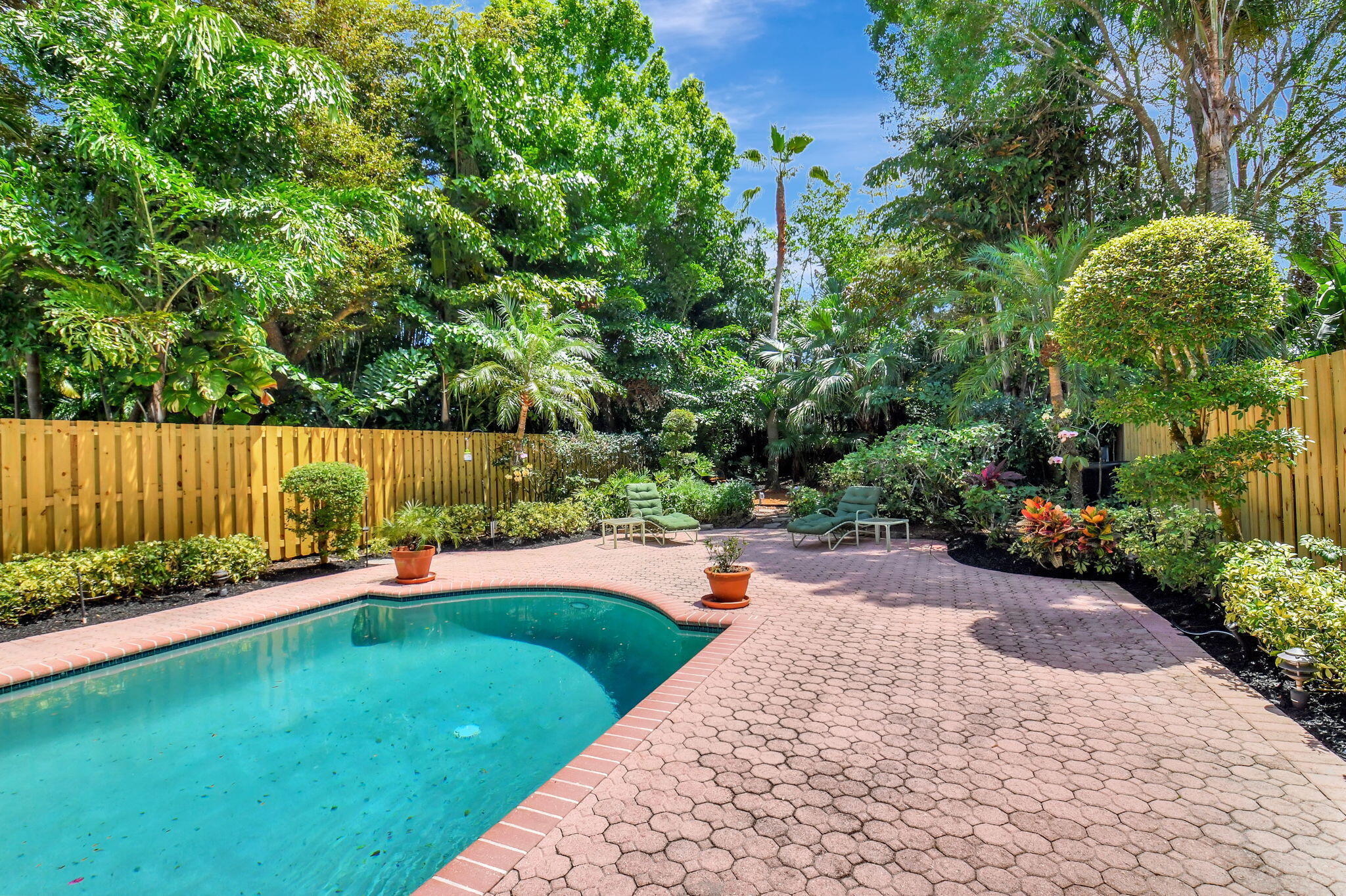2462 Northwest 66th Drive Boca Raton, FL 33496 - Photo 34 of 49 a view of a backyard with a garden