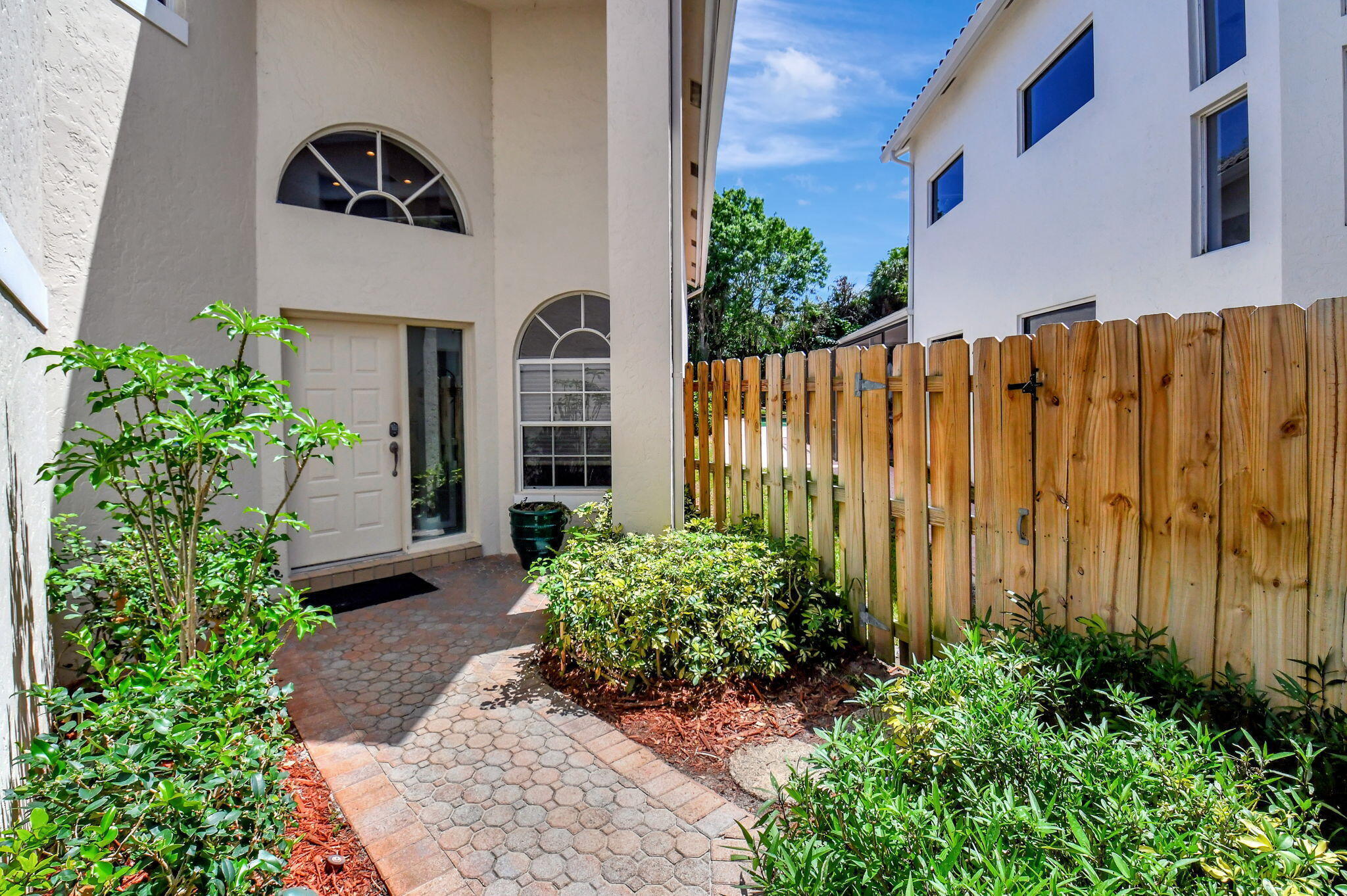 2462 Northwest 66th Drive Boca Raton, FL 33496 - Photo 4 of 49 a view of a house with potted plants