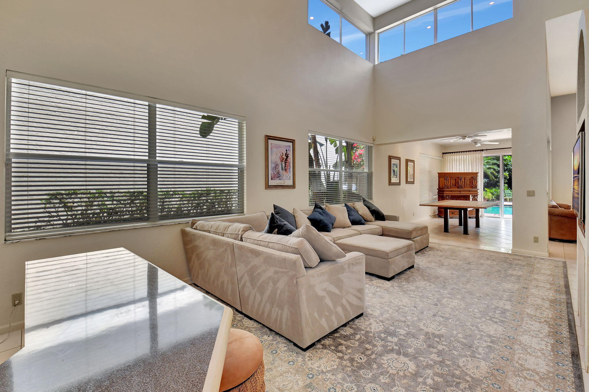 2462 Northwest 66th Drive Boca Raton, FL 33496 - Photo 6 of 49 a living room with furniture and a large window