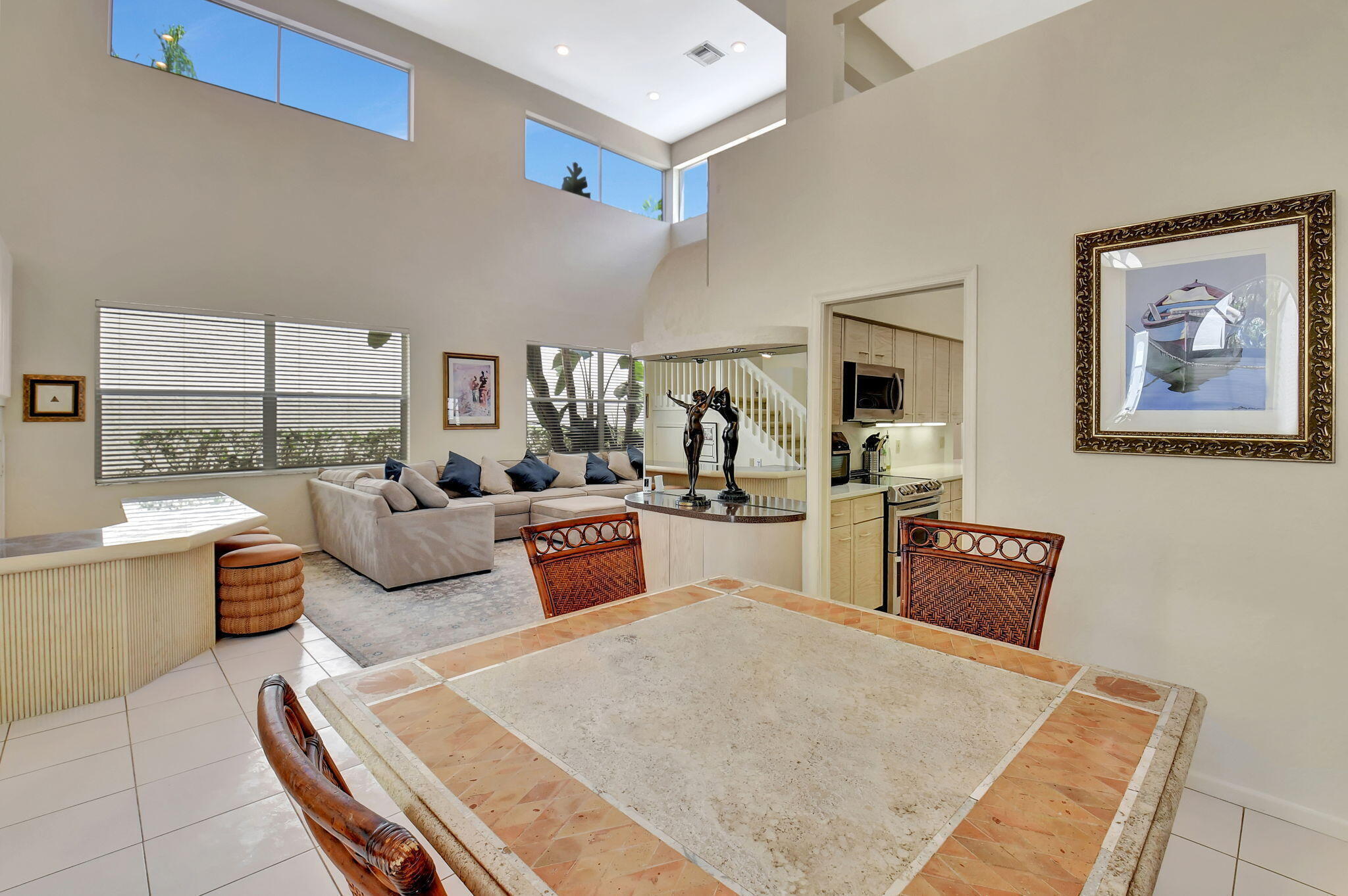 2462 Northwest 66th Drive Boca Raton, FL 33496 - Photo 9 of 49 a living room with furniture and a table