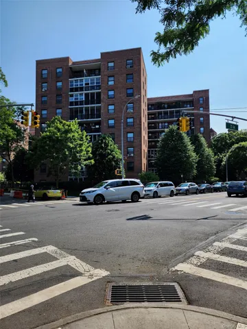 a view of street with parked cars