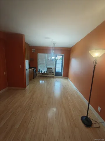 a view of a livingroom with a furniture and wooden floor