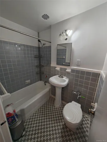 a bathroom with a sink toilet a shower and a bathtub