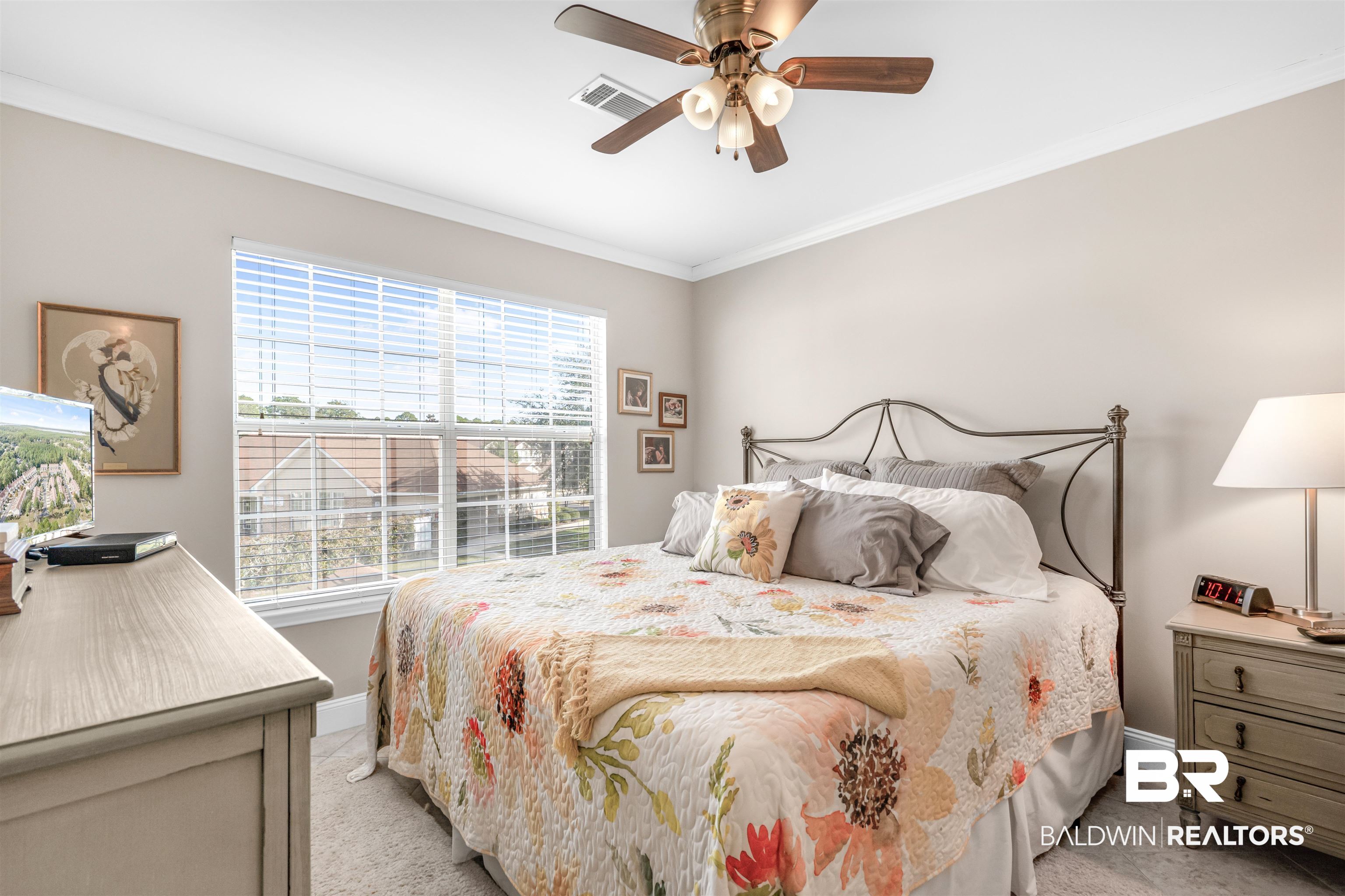 1517 Regency Road, Unit 68 Gulf Shores, AL 36542 - Photo 17 of 43 Carpeted bedroom with ceiling fan and ornamental molding