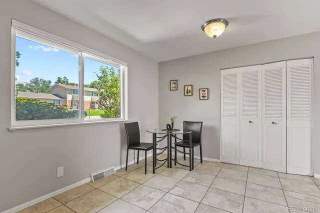 a view of a livingroom with furniture and window